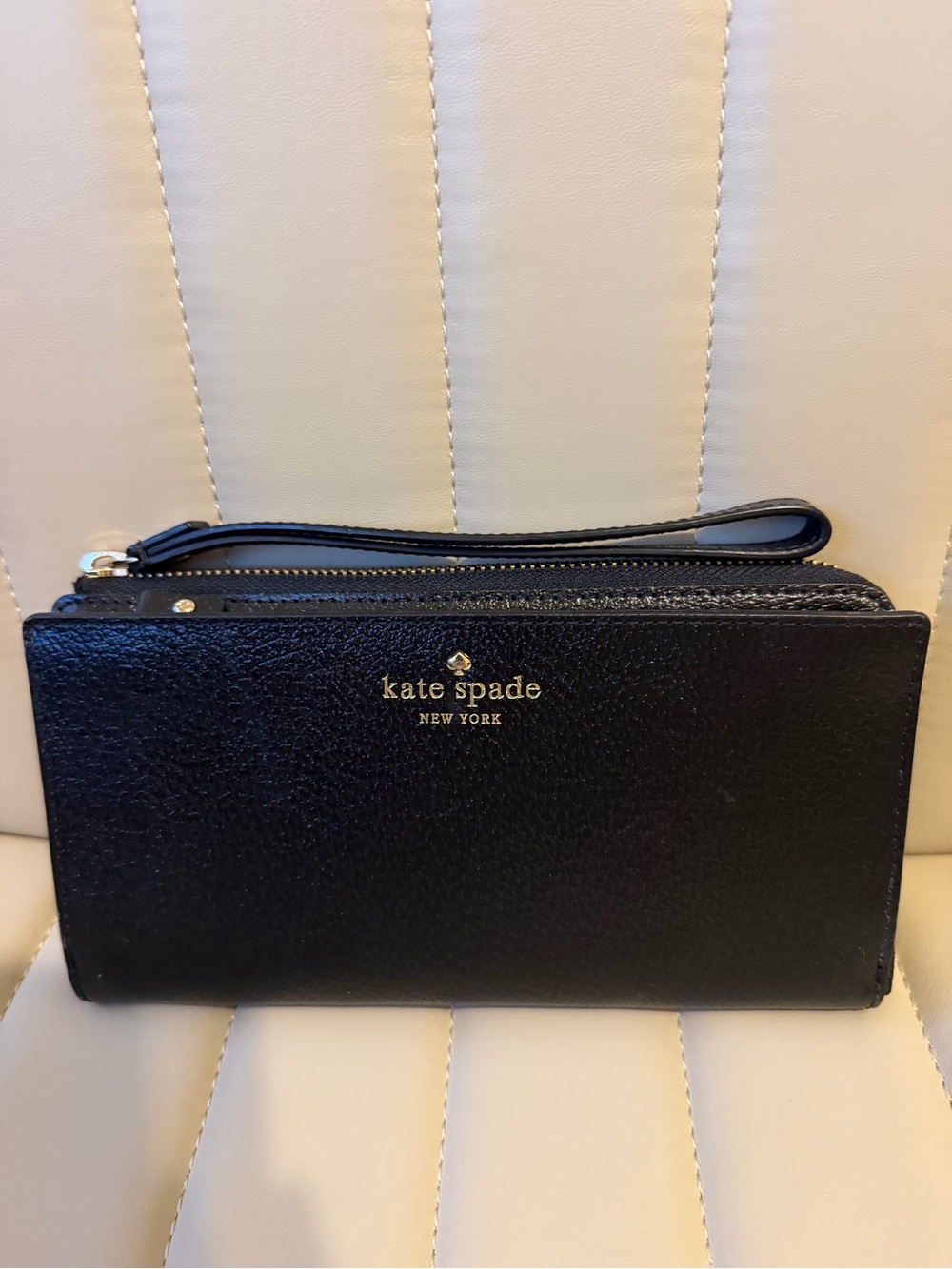 kate spade black leather wristlet clutch with gold logo